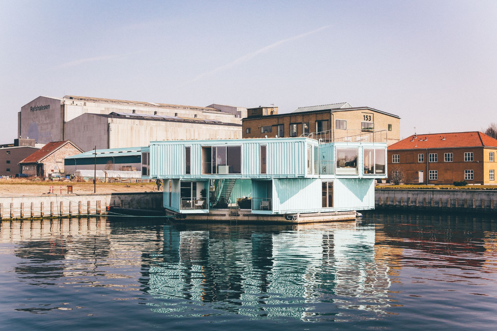 Two shipping containers stacked to create a unique home on the water