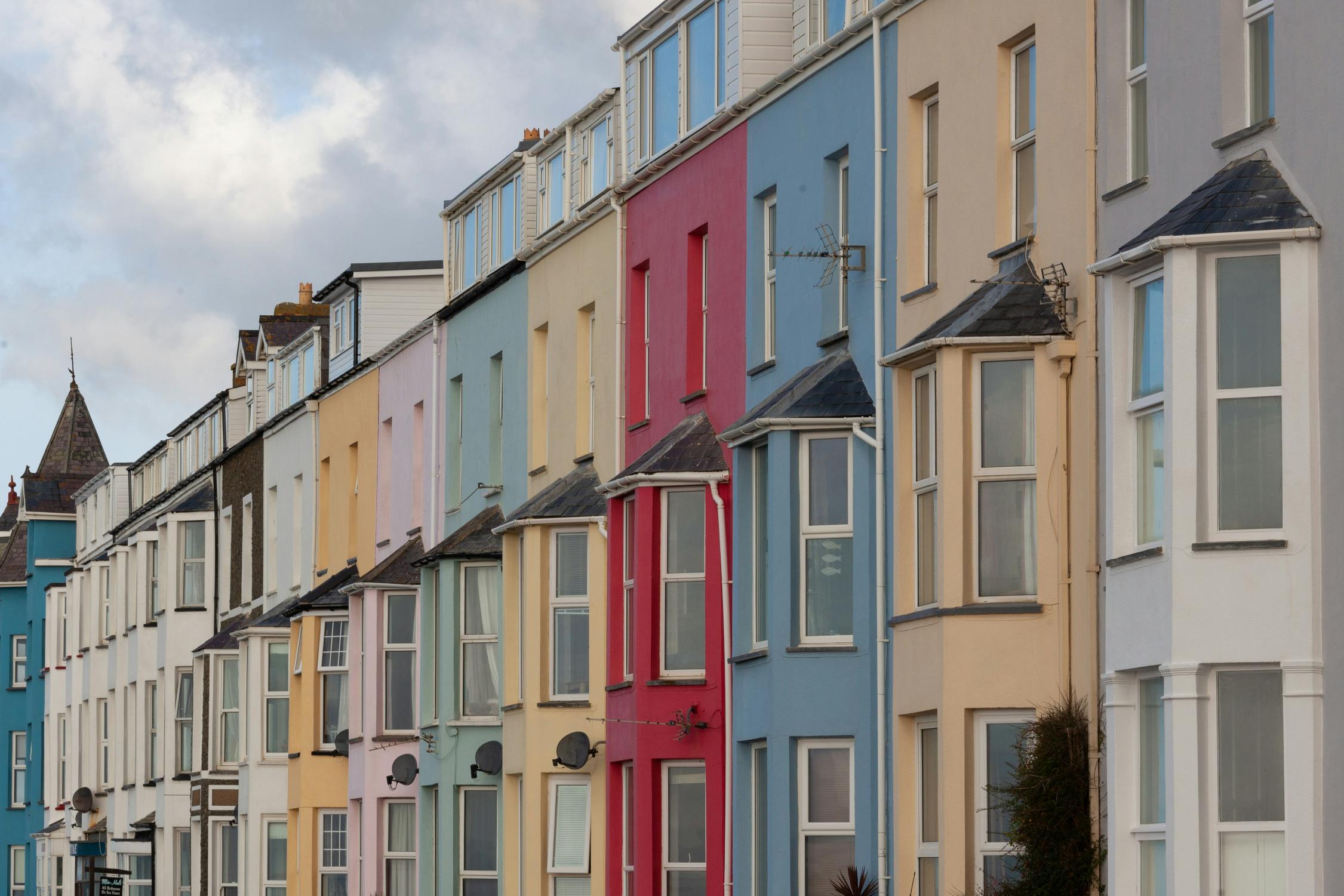 A rw of colourful terraced houses in the UK
